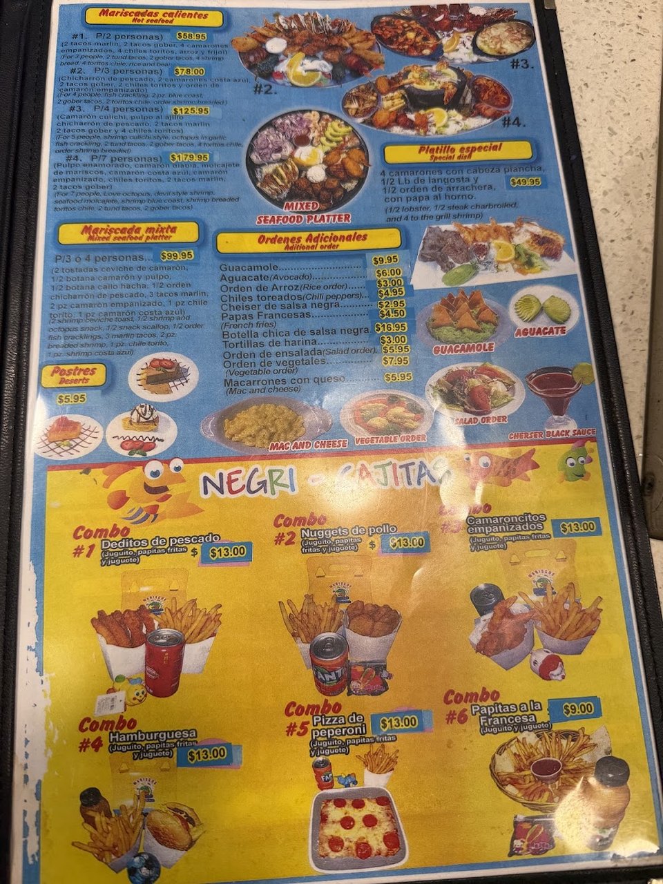 Restaurant menu laid out on a table.